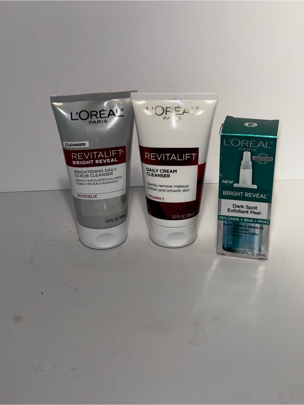 L'Oreal Revitalift Cleansers & Exfoliant Peel Bundle of 3- White, Silver & Teal